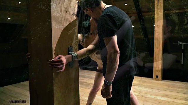 Sexy slave in submission getting spanked by bondage master