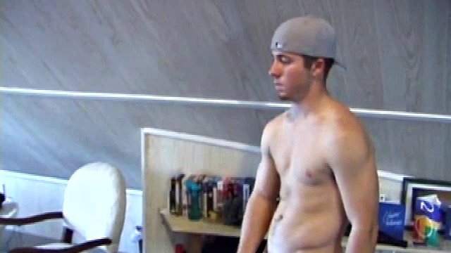 Cory Woodall watches a porn video, while standing by his skateboard. The camera takes us on a sexy tour of Cory's body, which looks cuter than ever. Seen from the ground, this boy's balls are fucking huge.
