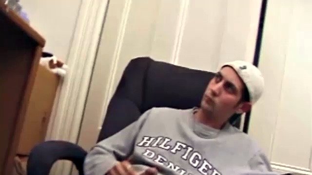 While playing a porn video, Aaron strokes himself hard and then pulls his dick out of his jeans. After a good long stroking show, this young man lets loose and spills his hot sticky cum all over the bed.