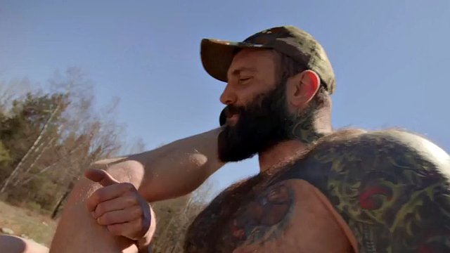 A military bear fucks his bottom bareback outdoors on a quad