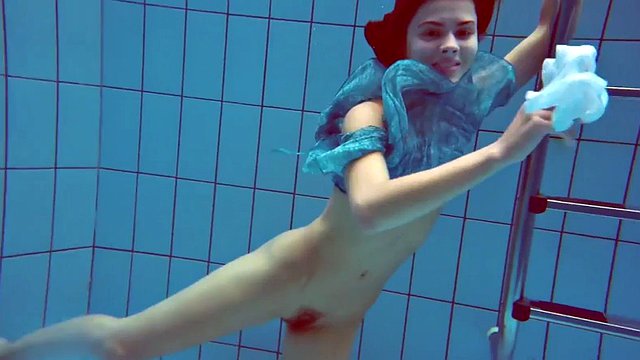 Beautiful redhead hairy pussy underwater
