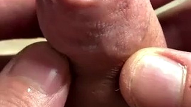 Extreme closeup playing with foreskin and piss, then wanking a string of thick cum into my hand