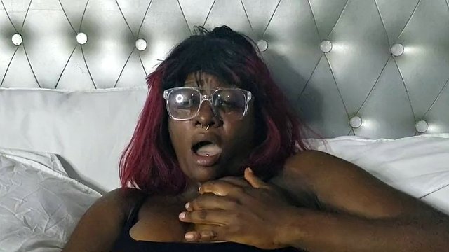 Sexy black brunette was alone at home and was bored, but she made herself squirt while watching porn