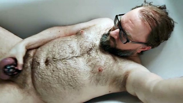 Some solo chastity watersports in the bathroom for this pee-thirsty locked-up bear