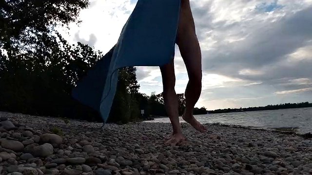Slim nudist boy doing yoga naked on a nudist beach. Nude yoga video by John Artin, gay porn model, skinny naturist, twink, practice