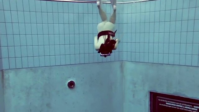 flast as a pancake roxolana swims naked underwater with a diving mask