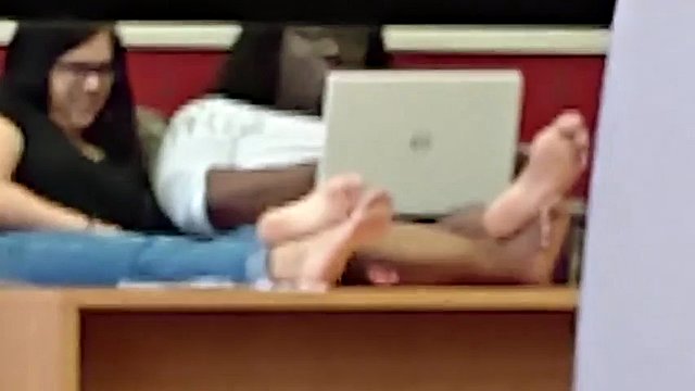 Candid two pairs of big soles in a public college