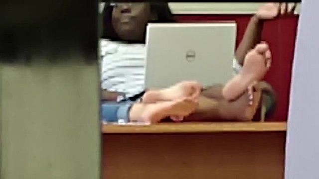 Candid two pairs of big soles in a public college