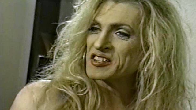 Crossdresser taking off her makeup and dress