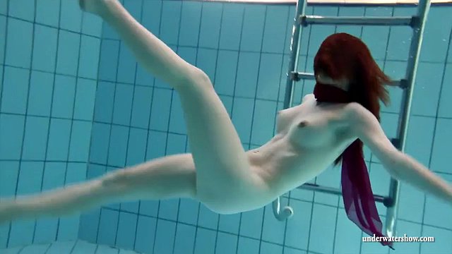 Cheerful naked girls are naughty in the pool