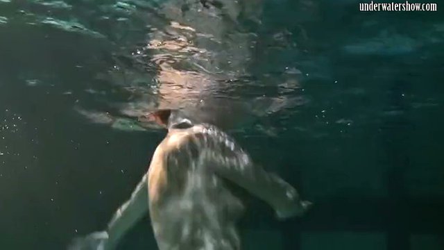 Clothed underwater beauty Bulava Lozhkova swimming naked