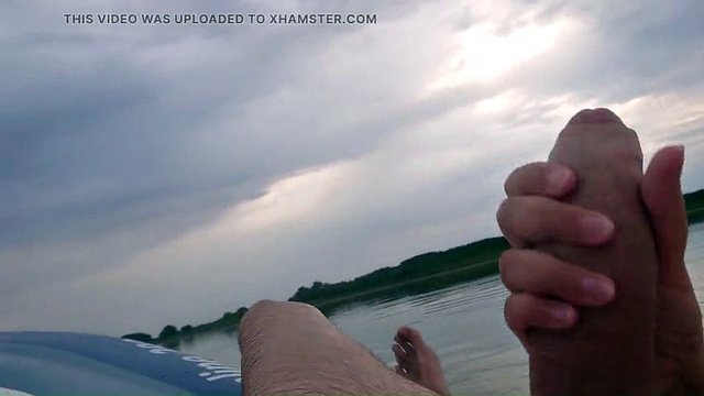 My wife jerks off my dick with a happy ending in the inflatable boat on the lake