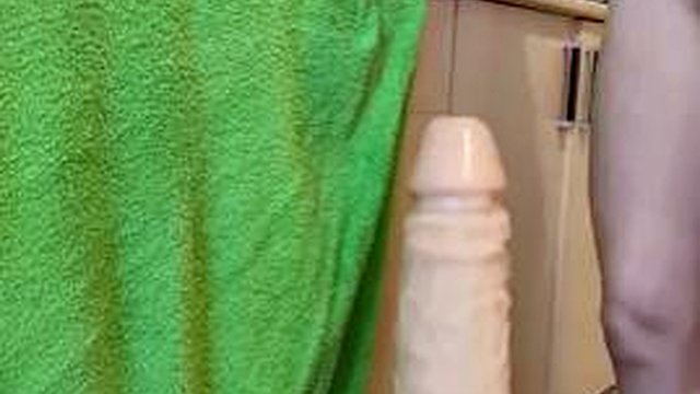 Petite MILF gets impaled on a giant monster dildo