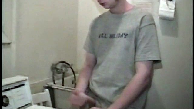 This guy from next door spreads his new porn magazine on the washing machine and pulls his cock out from under the fly of his baggy shorts without even letting his balls play.