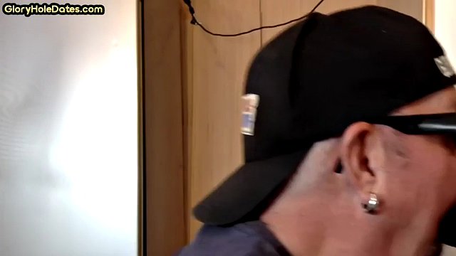 Mature gay cocksucker fucked through glory hole in homemade video close up