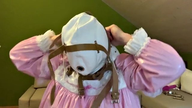 Sissy in diaper with bondage hood