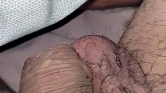 The stepson hides his huge erection under a blanket from the stepmother