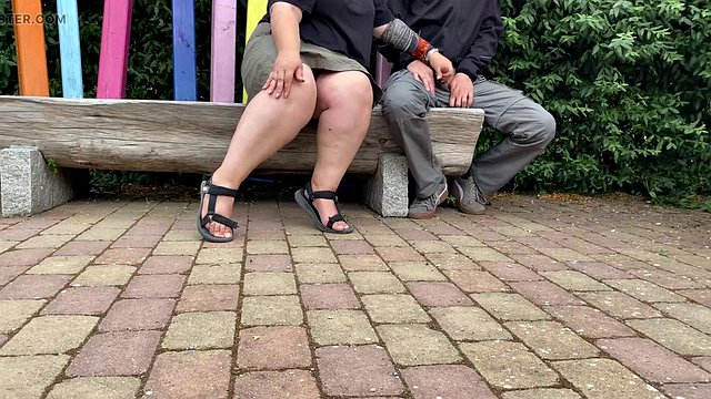 Mother-in-law masturbates her stepson's cock in a public park