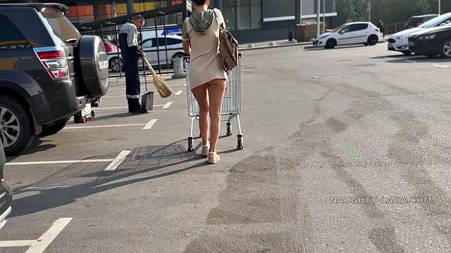 NL in short dress walking around a market